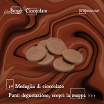 Immagine con la grafica di Un Borgo di Cioccolato 2023 che rappresenta medaglioni di cioccolato, degustabili al punto uno del percorso (Palazzo Bertello)